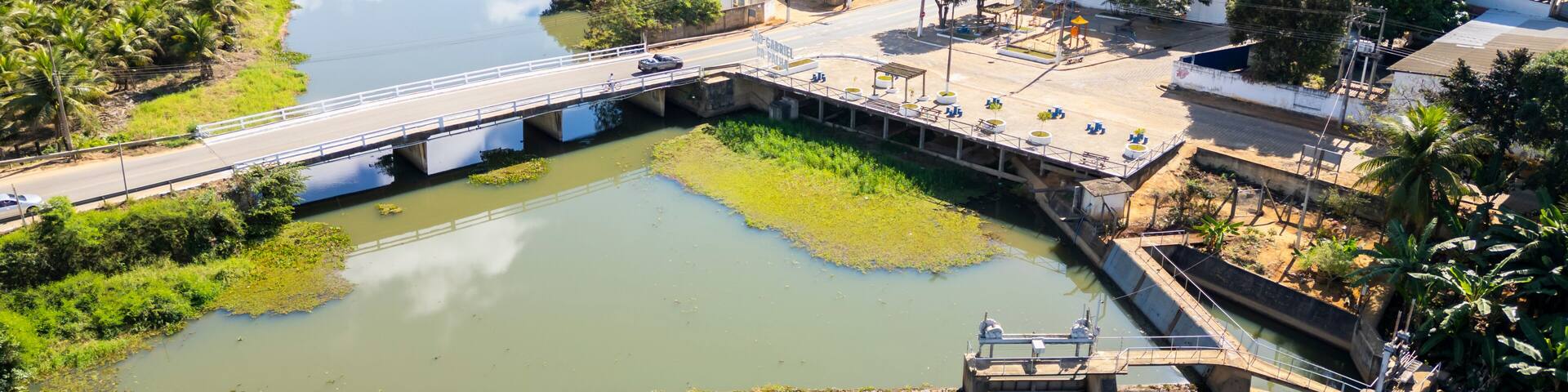 Aerial Drone view of the bridge over Sao Jose river and the small hydroelectric dam in Sao Gabriel da Palha, ES, Brazil