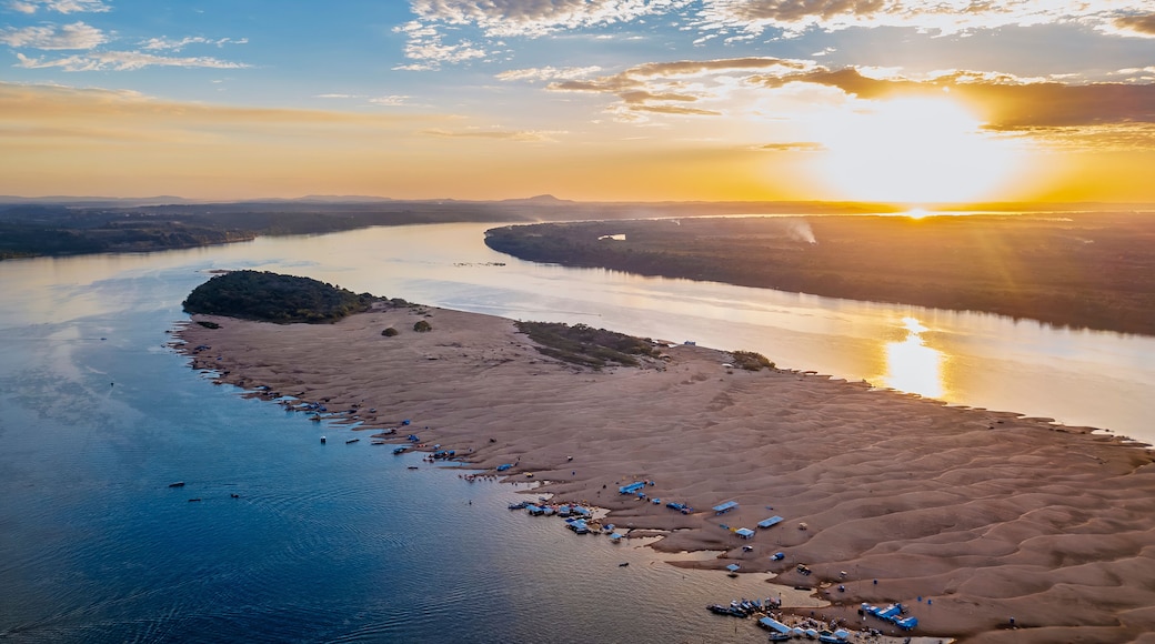 Aerial drone view of sandy river beach on Rio Grande in Pará, Brazil, with boats, people, golden sunset, natural landscape, and Amazon region scenery captured by DJI Mavic 3