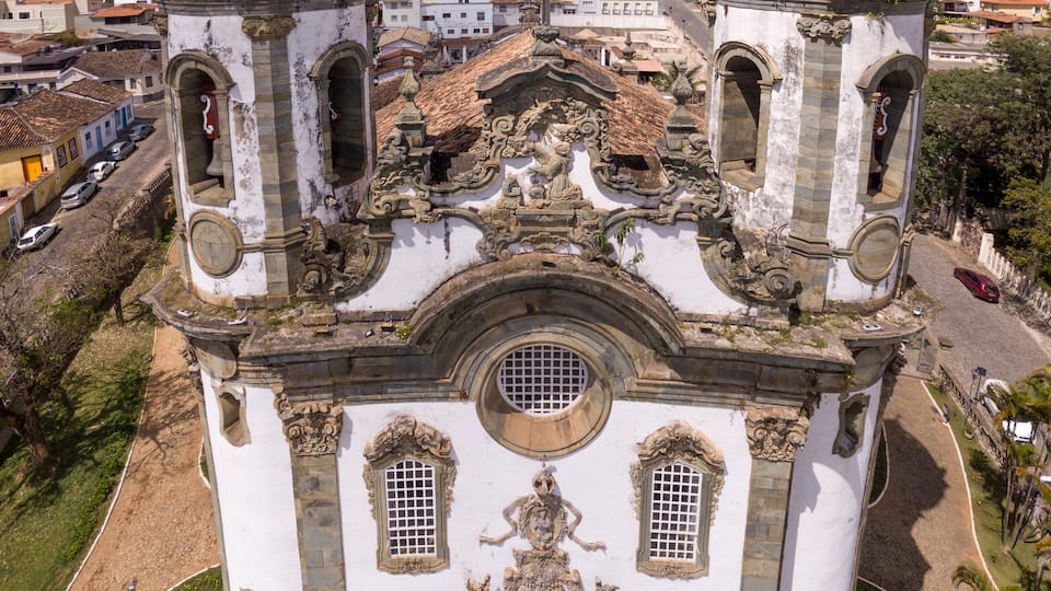 A historic church with two bell towers and ornate facade.