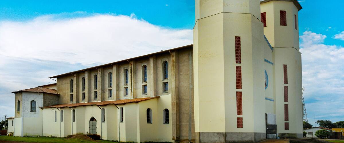 A large church with a bell tower and arched windows.