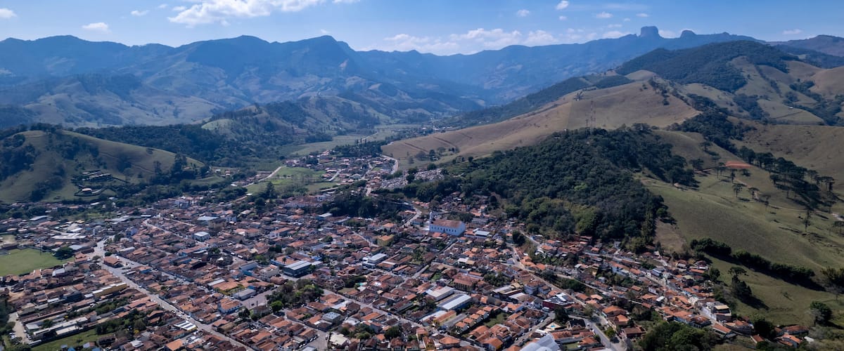 A town nestled in a valley surrounded by mountains.