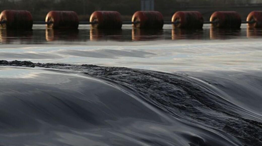 Gunthorpe weir An underwater object breaks the smooth passage of the water over the top tiers of the weir.