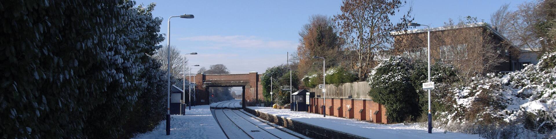 Radcliffe railway station in the snow - looking west along the westbound platform.
