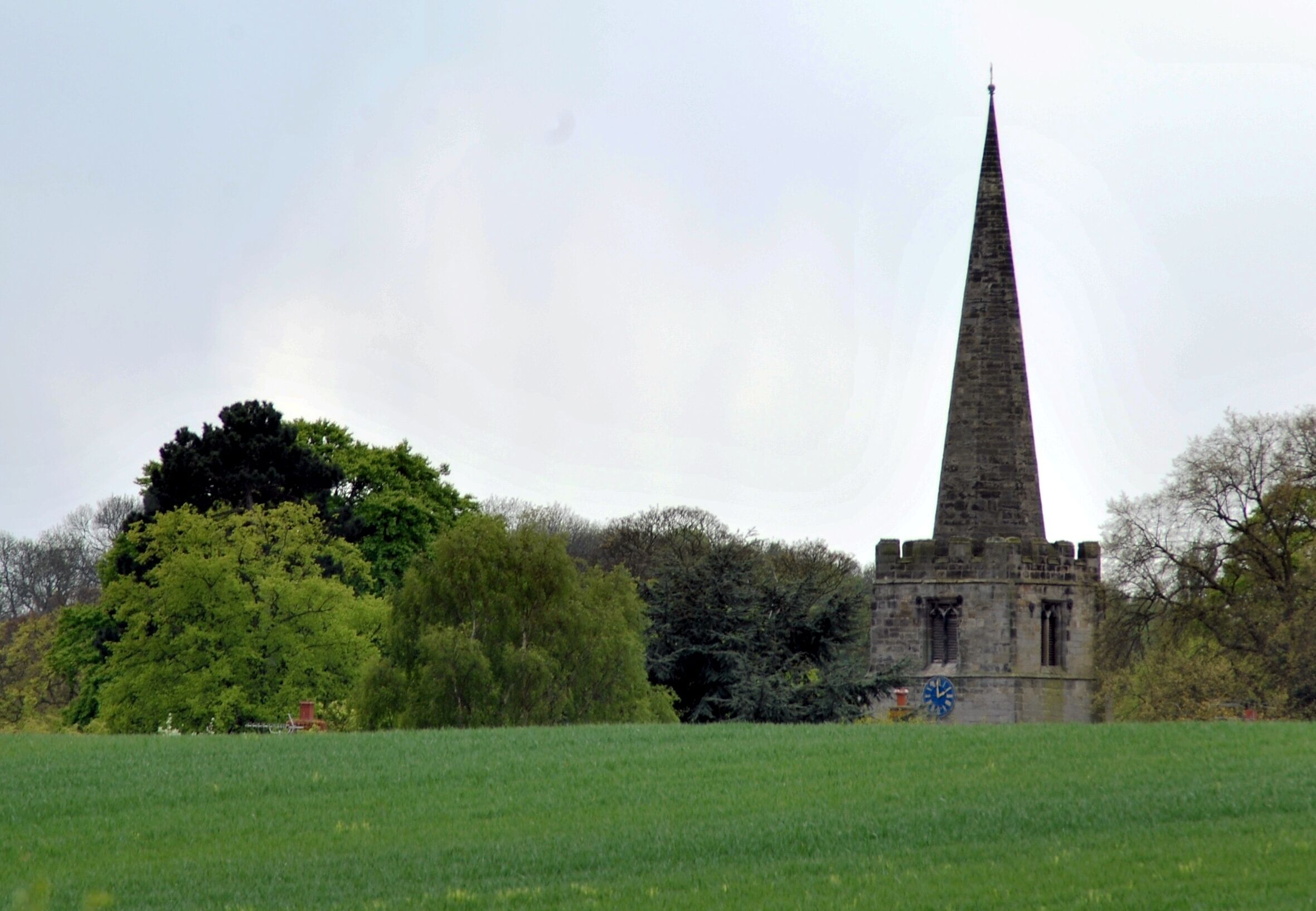 View across a field near Cotgrave Country Park,Nottinghamshire, to the west tower and spire of All Saints' parish church