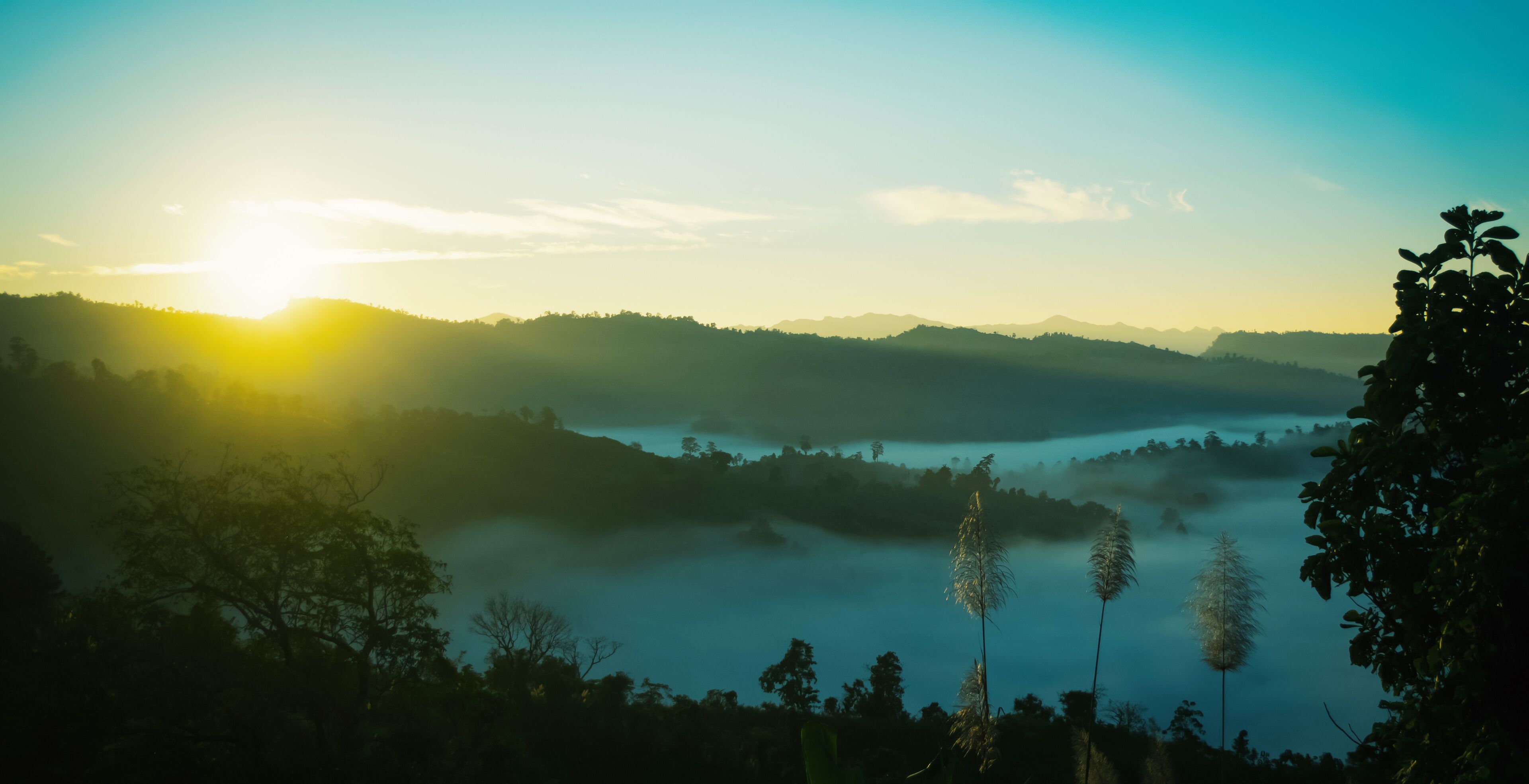 panorama of beautiful countryside of Bandarban, Bangladesh. sunny afternoon. wonderful springtime landscape in mountains. grassy field and rolling hills. rural scenery. Sajek, foggy morning sunrise