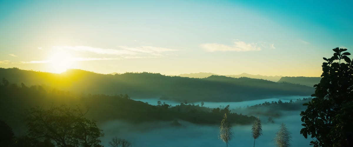 panorama of beautiful countryside of Bandarban, Bangladesh. sunny afternoon. wonderful springtime landscape in mountains. grassy field and rolling hills. rural scenery. Sajek, foggy morning sunrise