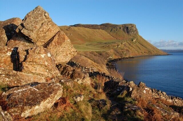 The Scorrybreac path The Scorrybreac path is a circular route to the north east of Portree. At this point the path winds between huge boulders that have fallen from the face of Ben Chracaig. Ahead, across the fields of the Bile, is Creag Mhor, towering over the Sound of Raasay.