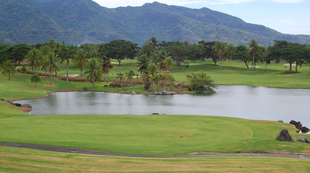 Golf course with trees, mountain, and lake at Mount Malarayat in Lipa, Batangas, Philippines