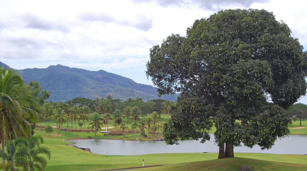 Golf course with trees, mountain, and lake at Mount Malarayat in Lipa, Batangas, Philippines