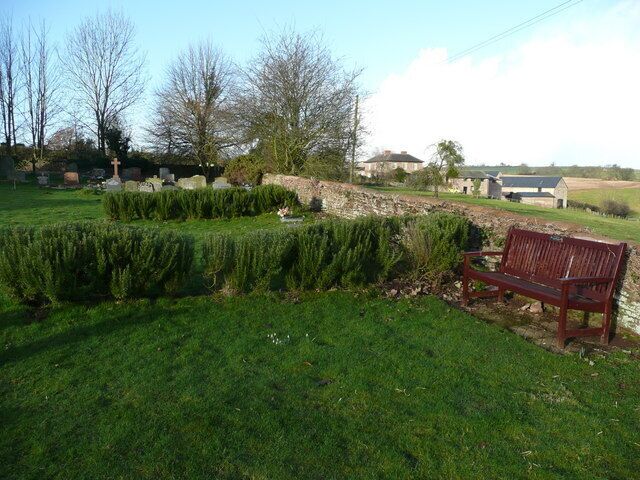 Part of Peterstow churchyard Areas of contemplation sectioned off with low rosemary hedges. The farm in the background is called The Flann.
