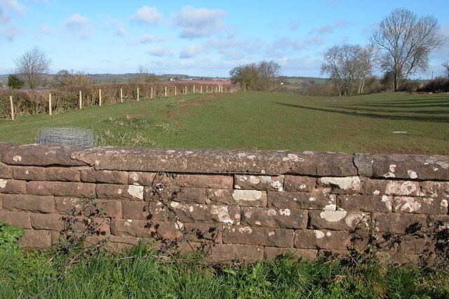 Course of the old Ross to Hereford railway. Viewed from the old railway bridge carrying a track to Strangford, at some time the railway cutting has been filled in.