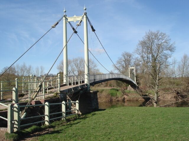 Suspension Footbridge over the River Wye This bridge was designed and built by Louis Harper in 1895 at the request of local folk who wanted their vicar to be able to move easily between his two churches at Sellack and Kings Caple. The Harper Bridges web site has excellent information on the many bridges they constructed around the country and the fence post patent which led to the success of the company. There is still evidence of at least one more bridge to be found over the Derwent - a job for Geograph-ers? http://www.harperbridges.com