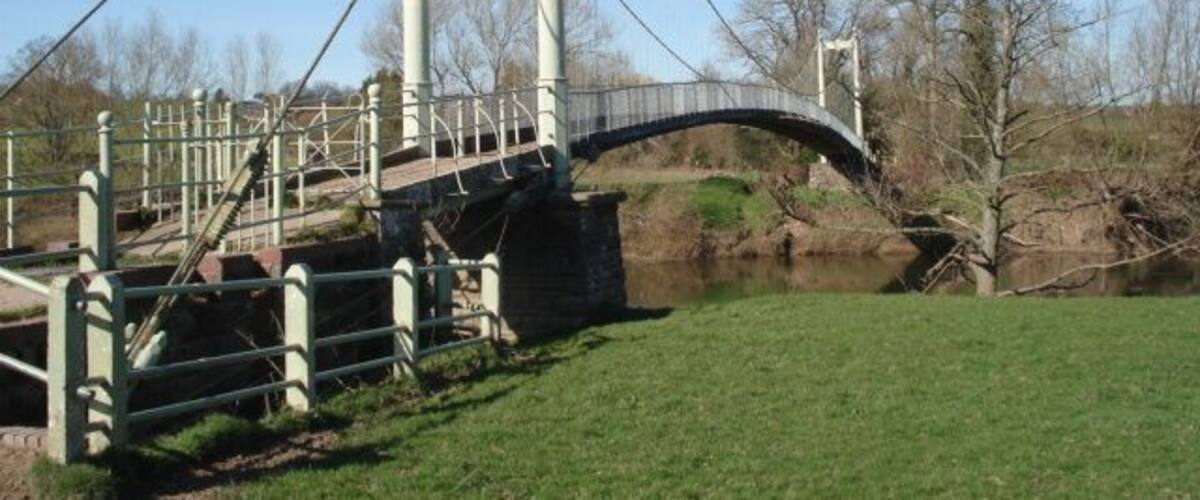 Suspension Footbridge over the River Wye This bridge was designed and built by Louis Harper in 1895 at the request of local folk who wanted their vicar to be able to move easily between his two churches at Sellack and Kings Caple. The Harper Bridges web site has excellent information on the many bridges they constructed around the country and the fence post patent which led to the success of the company. There is still evidence of at least one more bridge to be found over the Derwent - a job for Geograph-ers? http://www.harperbridges.com