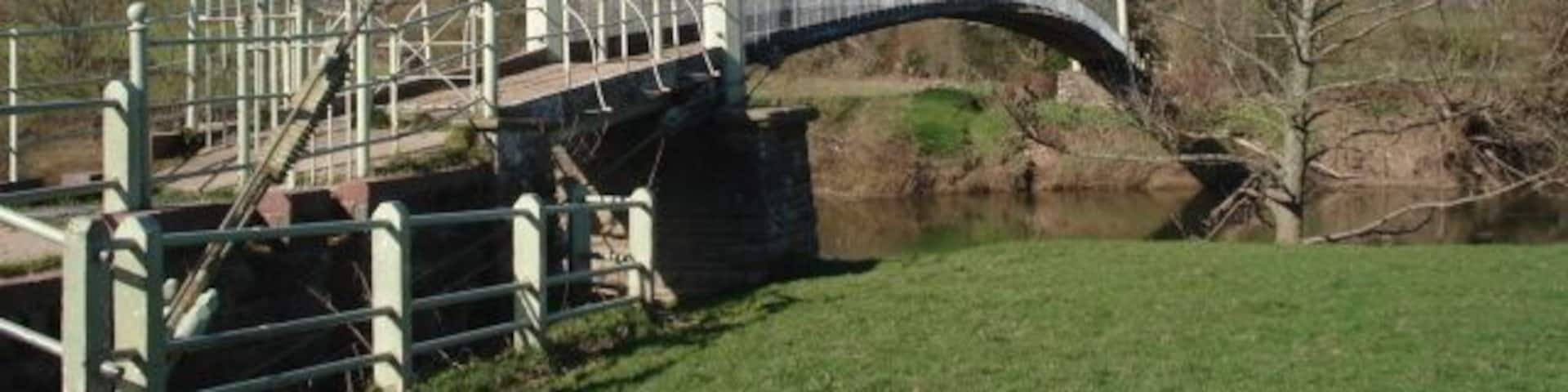 Suspension Footbridge over the River Wye This bridge was designed and built by Louis Harper in 1895 at the request of local folk who wanted their vicar to be able to move easily between his two churches at Sellack and Kings Caple. The Harper Bridges web site has excellent information on the many bridges they constructed around the country and the fence post patent which led to the success of the company. There is still evidence of at least one more bridge to be found over the Derwent - a job for Geograph-ers? http://www.harperbridges.com