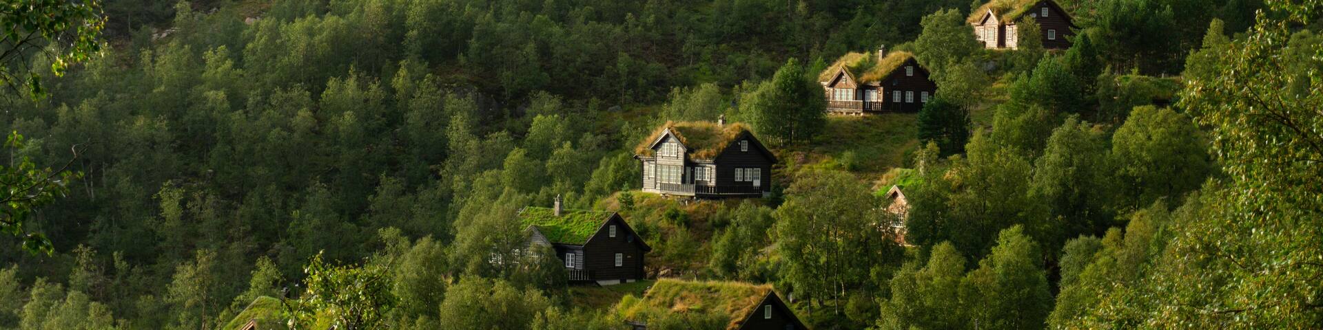 Sirdal Agder Norway - Traditional Wooden Cabins with Sod Roofs on Forested Hillside