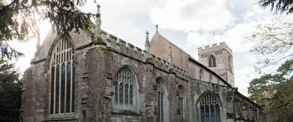 An old church with Gothic architecture, including pointed arches and stained glass windows.
