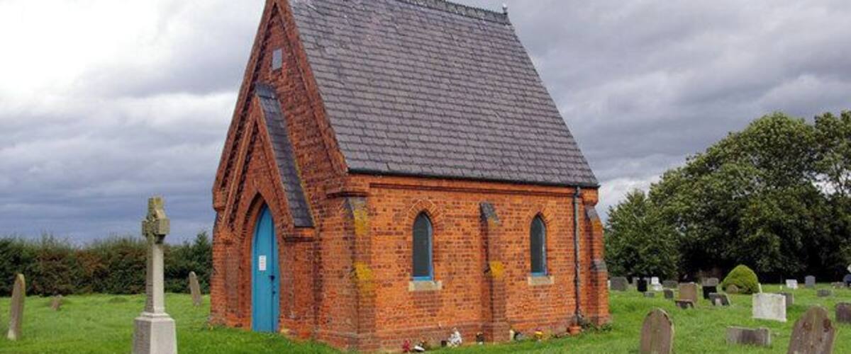 North Kelsey Cemetery. Picture shows cemetery chapel and war memorial cross (left foreground).