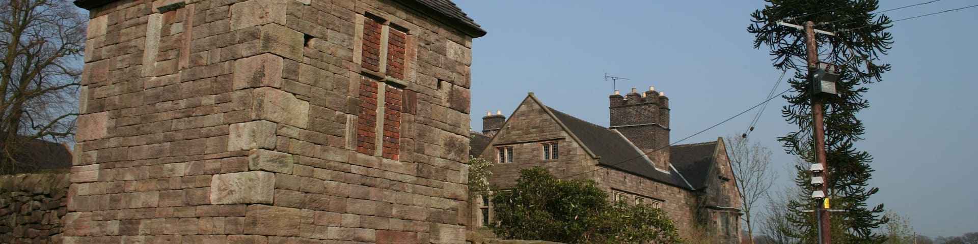 Whitehough Both the 17th-century farmhouse and the 18th-century gazebo in the foreground are Grade II* listed.