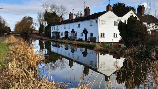 Cottage reflections in the Trent and Mersey Canal near Barlaston.
