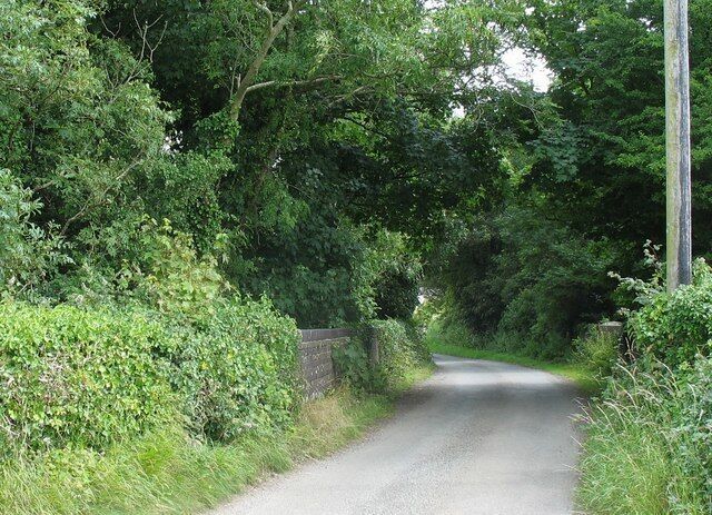 Approaching the bridge over old railway line from the Llanbedrgoch direction 907414