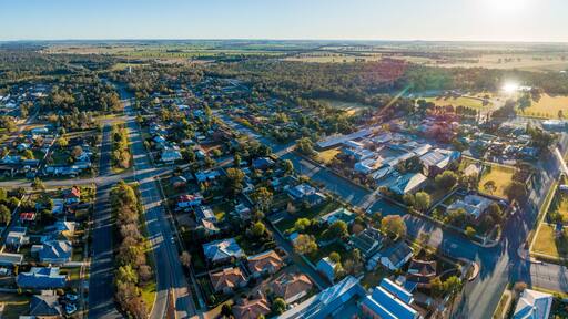 Panoramic aerial view of country town homes on sunny morning