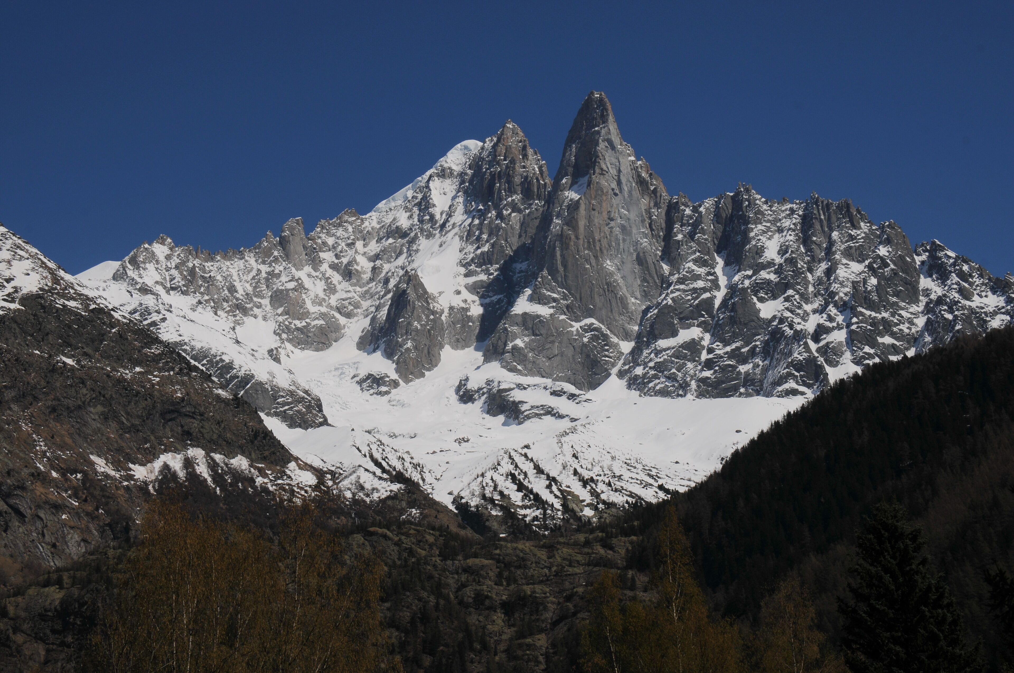 Panoramic view of Les Drus 3751m (the rocky peak in the middle) with somewhat left the snowy top of Aiguille Verte 4122m
