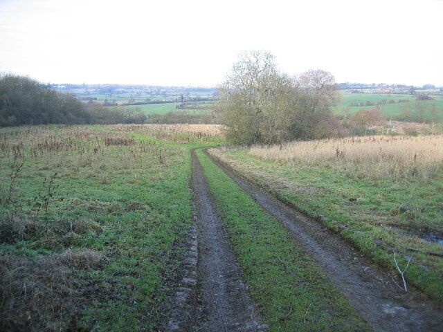 View near Darklane Copse. Darklane Copse is on the left, and the view is looking north with the track leading down to the sewage farm in the adjacent square.