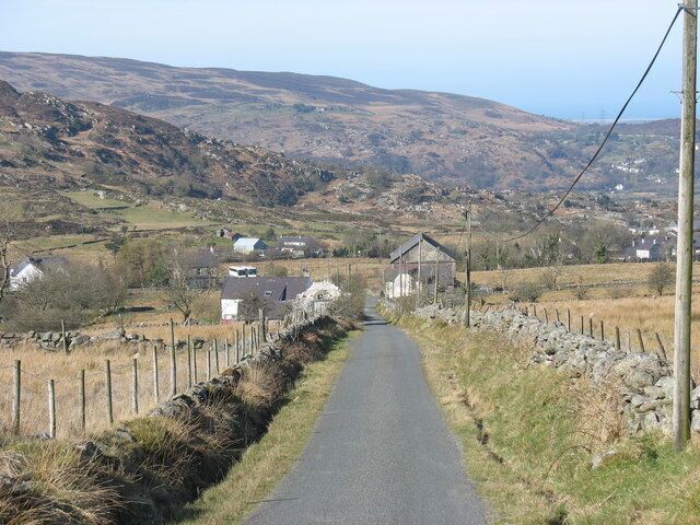 Looking down Lon Cefn Waen towards Blaen y waen Cottage and Capel Cefnywaen This road leads from 'Y Mynydd' (the mountain). Pobl y Mynydd (people of the mountain) i.e. of the upland smallholdings considered themselves a 'race' apart from Pobl y Pentra (village folk), and a superior one at that. Very few of the old stagers now remain, many of the mountain cottages have been purchased by incomers.