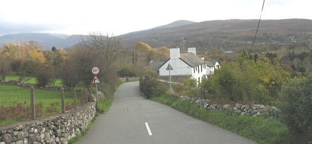 Pontrhythallt Hill The Deiniolen-Caernarfon road descends down hill towards the two humped back bridges on the valley floor up which lead to the village of Llanrug.