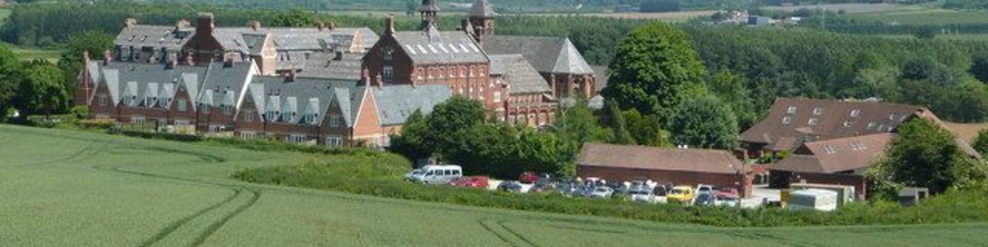 Bartestree Convent and St. Michael's Hospice The main convent buildings closed as a convent in 1992 and are now flats and apartments. The newer buildings to the right are those of St. Michael's Hospice, a charitable organisation which specialises in respite and end-of-life care. See; http://www.st-michaels-hospice.org.uk/ The view is east from Longworth Lane with the Malvern Hills in the far distance.