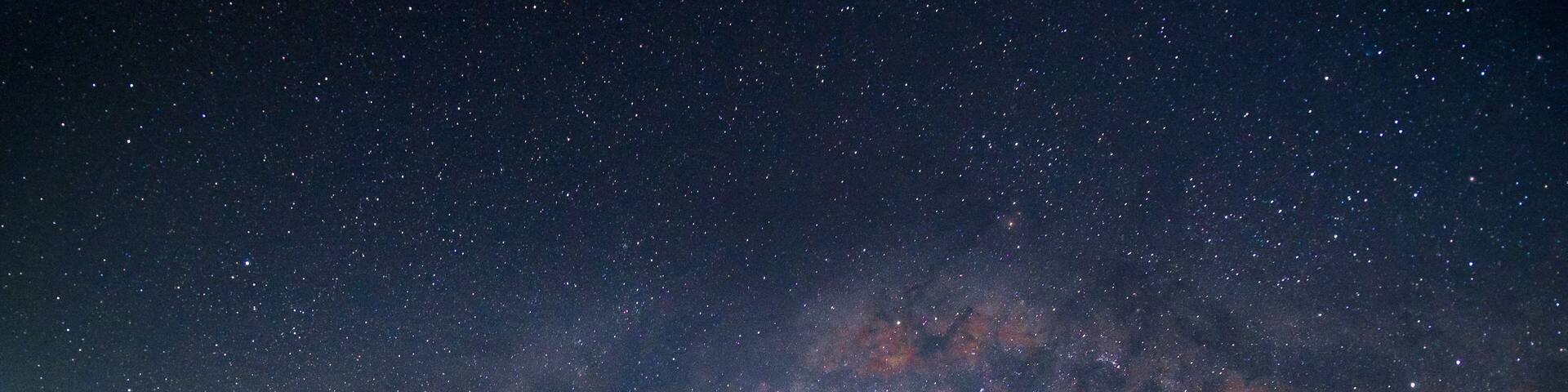 Milkyway over the outdated hut in the early of night at Muadzam Shah, Pahang, Malaysia ( Visible noise due to high ISO, soft focus, shallow DOF, slight motion blur)