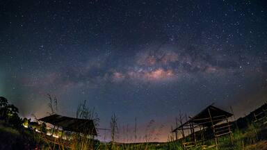 Milkyway over the outdated hut in the early of night at Muadzam Shah, Pahang, Malaysia ( Visible noise due to high ISO, soft focus, shallow DOF, slight motion blur)