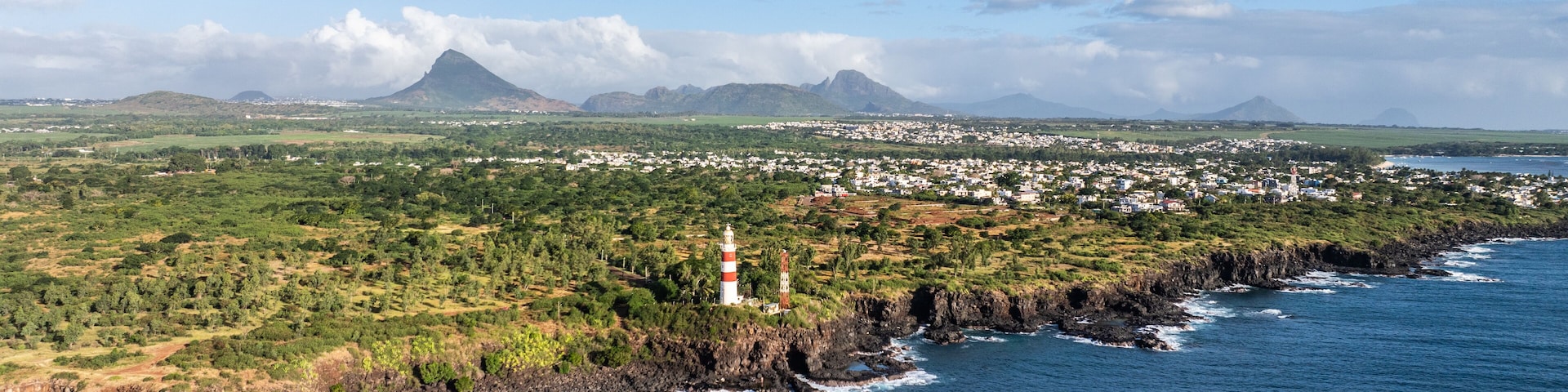 aerial landscape view of Mauritius west coast between Pointe aux Sables and Albion with deep cliffs and pointe aux caves lighthouse - aerial view