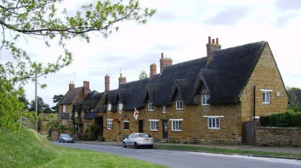 Althorp Inn and its neighbours The Althorp Inn, also known as the Fox and Hounds, is at the far end of the row. Next to it is the Post Office then a private house, all in the local ironstone with thatched rooves.