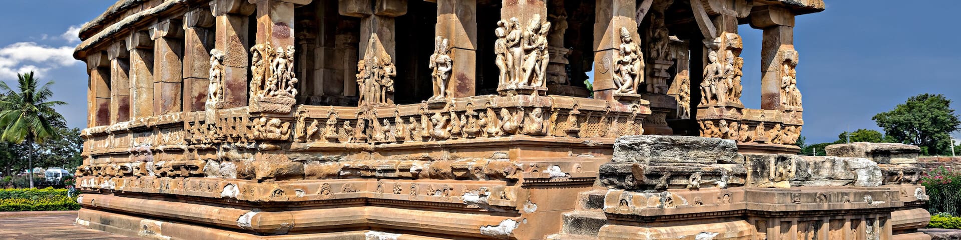 Entrance of Durga temple with blue sky and clouds, Aihole, Karnataka, India.