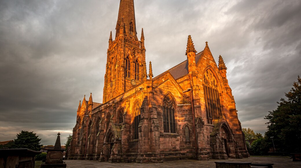 A Gothic-style church with a tall spire and intricate stonework.