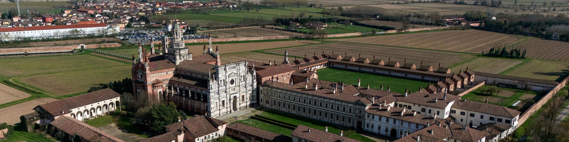 Aerial view of the Certosa di Pavia, built in the late fourteenth century, courts and the cloister of the monastery and shrine in the province of Pavia, Lombardia, Italy