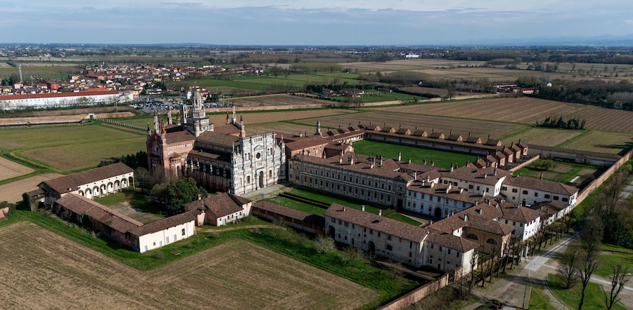 Aerial view of the Certosa di Pavia, built in the late fourteenth century, courts and the cloister of the monastery and shrine in the province of Pavia, Lombardia, Italy