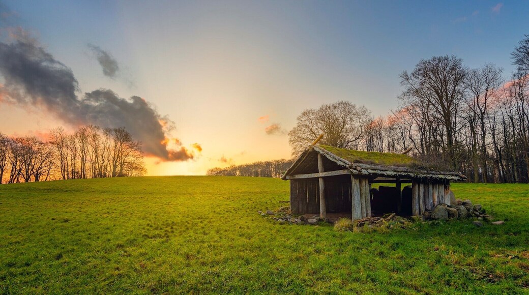 Old viking cottage at MoesgÄrd, Aarhus, Denmark during sunrise. The place is usually used for large viking meetings during summertime. Only about 200m from the beach.