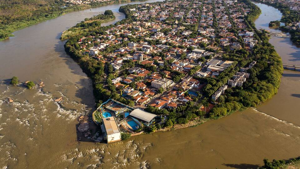 An aerial view of a densely populated island with a river running through it.