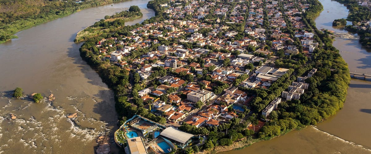 An aerial view of a densely populated island with a river running through it.