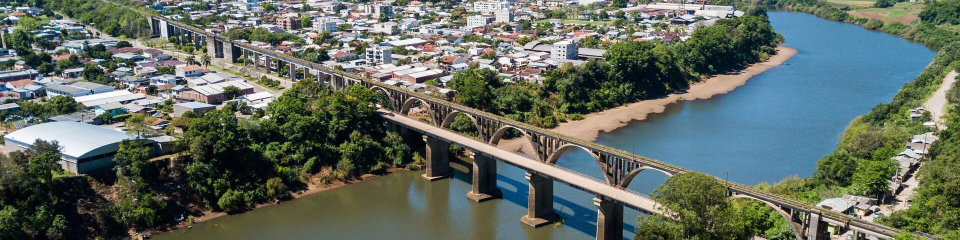 Muçum Bridge - Trigo Railway. Aerial view of the Brochado da Rocha railroad bridge, Taquari river and the city of Muçum, in Rio Grande do Sul