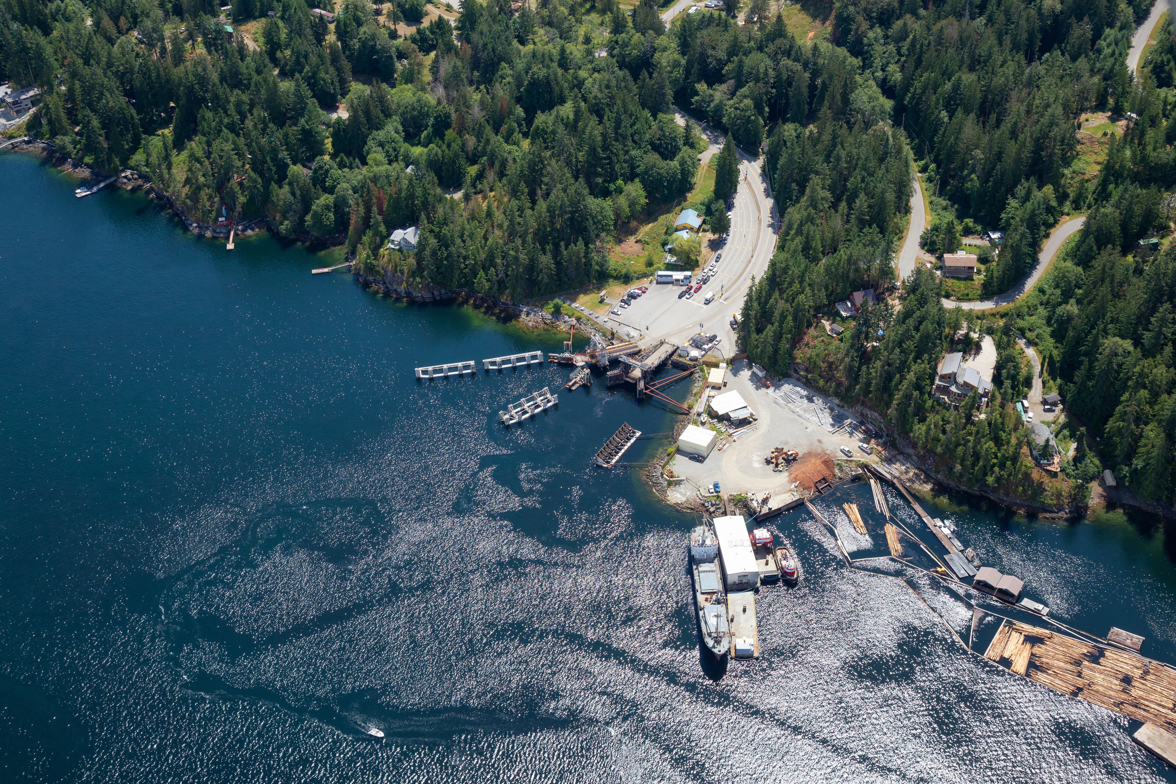 Aerial view of the Ferry Terminal in Earls Cove during a sunny summer day. Taken in Sunshine Coast, BC, Canada.