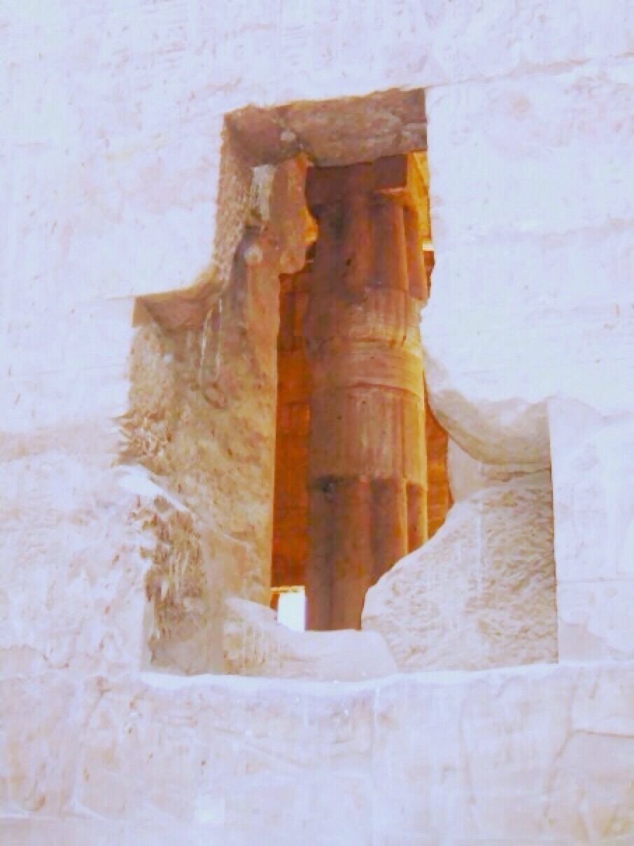 #roadtrip  The hole in the temple wall exposes the architectural column located within the chamber's interior. 