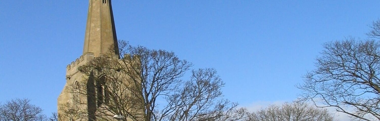 Church of St. Laurence, Surfleet. The top of the tower is 6 feet off perpendicular; a result of subsidence common on the soft ground of the Fenlands.