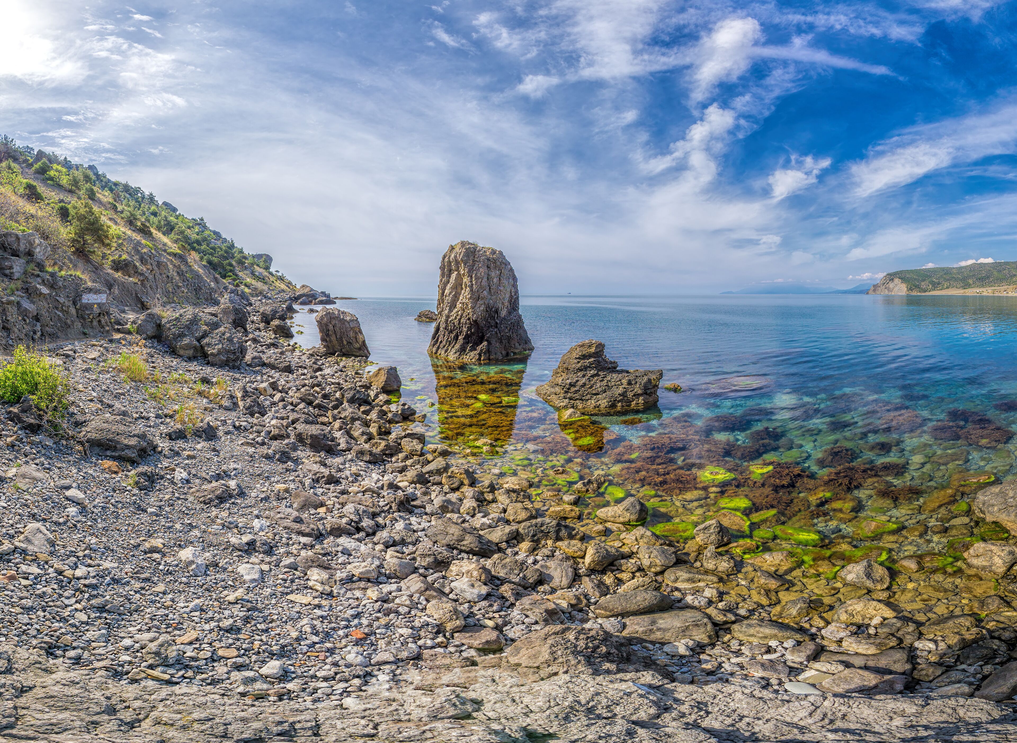 Panoramic View of Cape Ai-Fock, Veselovskaya bay and the beach of the village of Vesyoloe in the Crimea. On the foreground is the western foot of Mount Karaul-Oba. Azure Black Sea near Sudak