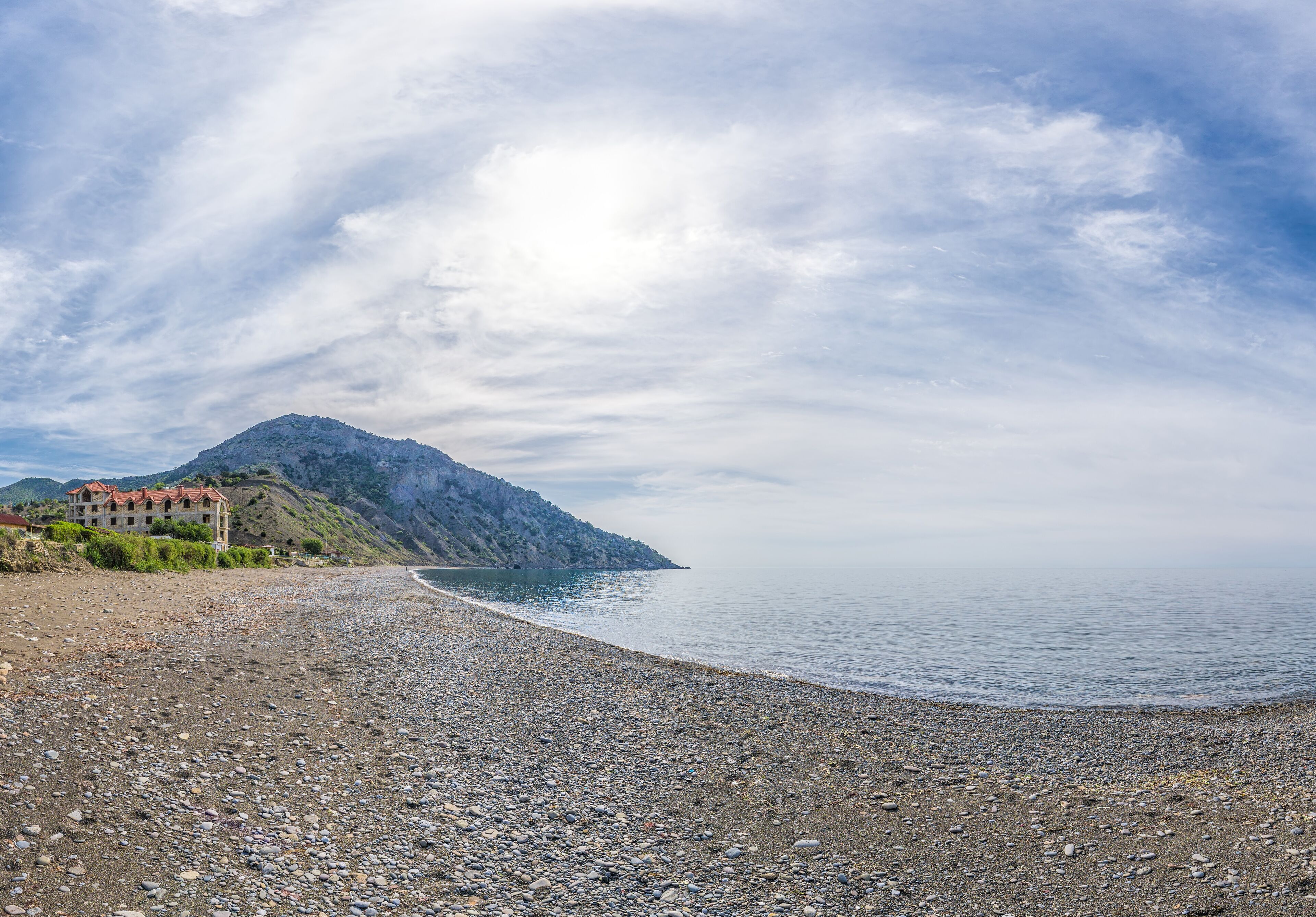 Panoramic View of Cape Ai-Fock, Veselovskaya bay and the beach of the village of Vesyoloe in the Crimea. On the foreground is the western foot of Mount Karaul-Oba. Azure Black Sea near Sudak