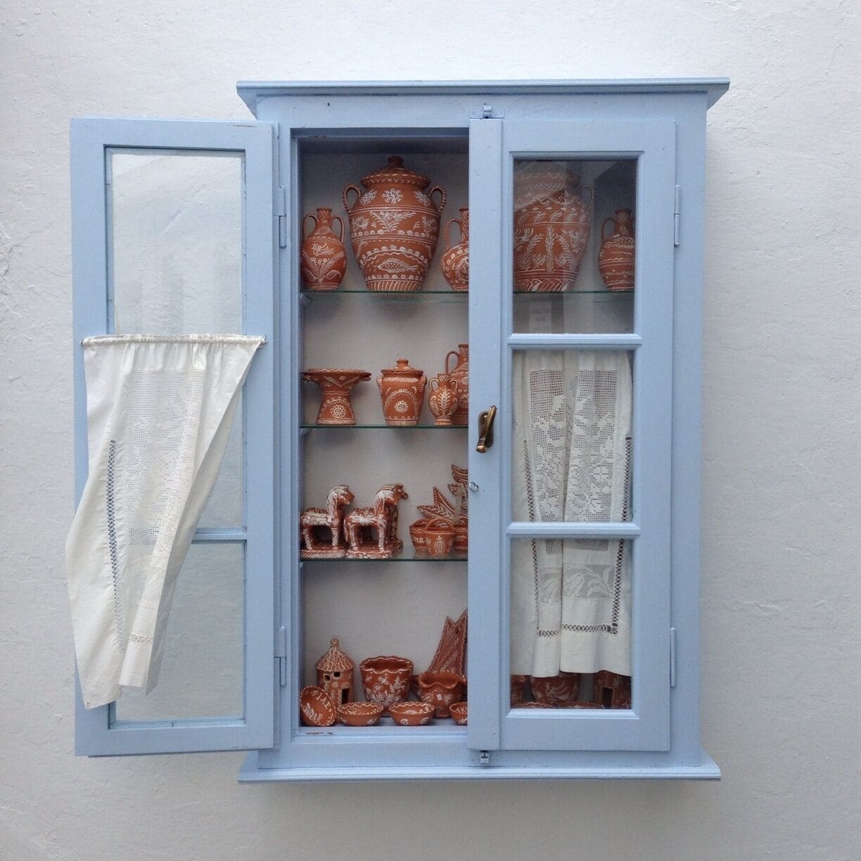 Artistic pottery. symbols for good luck and prosperity are depicted on the objects. 