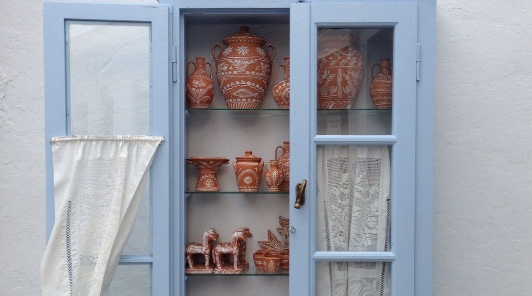 Artistic pottery. symbols for good luck and prosperity are depicted on the objects.