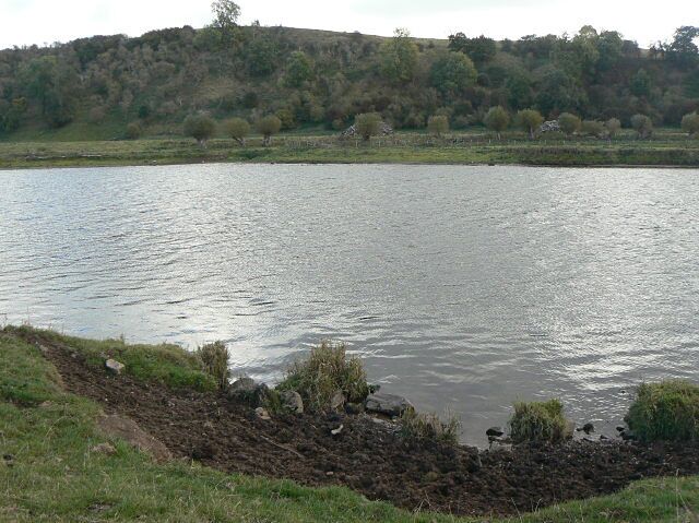 Just in square A short section of the left bank of the River Trent just cuts through the corner of the square. At this point it has been broken away a bit to create a drinking place for cattle. Across the river, the flat ground is called Watson's Piece, and the high point behind is called Toot Hill.